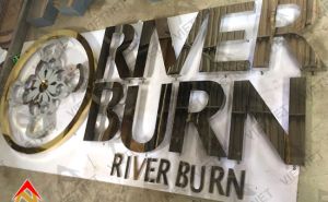 Gia công chữ inox trắng gương và logo River Burn