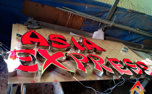 Bảng hiệu chữ inox lồng mặt mica Asia Express